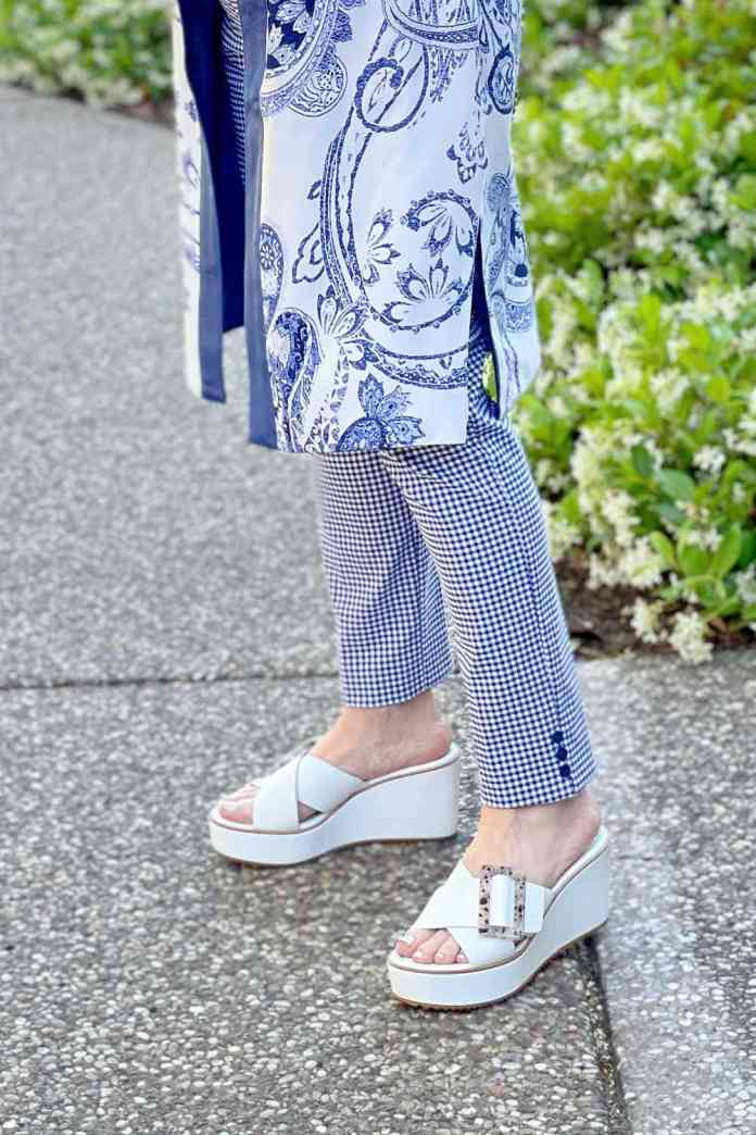 woman's legs showing blue and white jacket mixed with blue and white pants